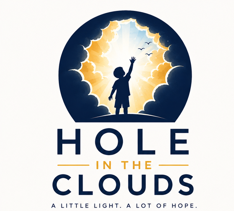 Hole in the Clouds logo: a child reaching toward light breaking through cloud, with the words Hole in the Clouds — a little light, a lot of hope